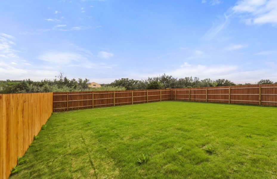 Exterior details and patio area of a home in Saddleback at Santa Rita Ranch, Liberty Hill (Image 31).