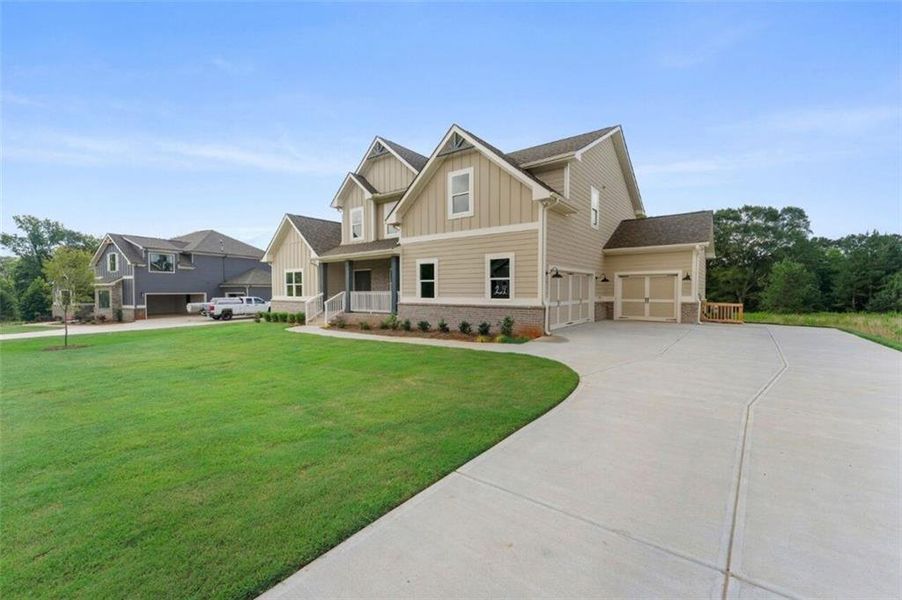 Front exterior of a new home in Steeplechase, Hoschton, GA, highlighting curb appeal (Image 22).