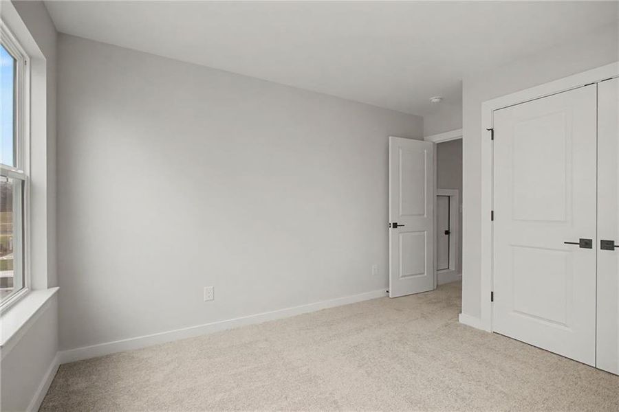 Spacious, unfurnished interior of a new home in The Park at Brighton, Locust Grove (Image 23).