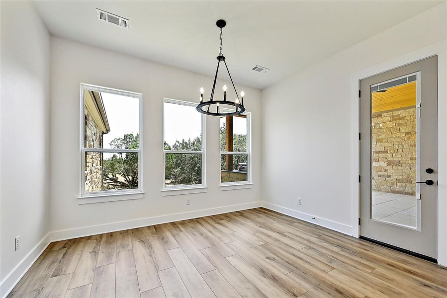 Breakfast area off the kitchen also opens to the back patio for easy transfer of your grilling masterpieces to the table.
