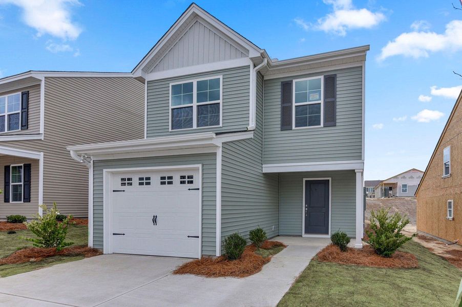 Front exterior of a new home in Central Creek, Goose Creek, SC, highlighting curb appeal (Image 1).