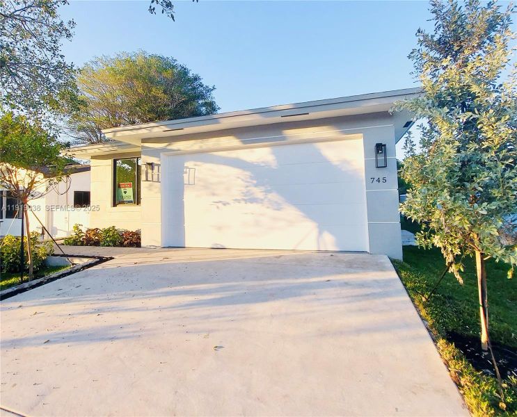 Front exterior of a new home in , Oakland Park, FL, highlighting curb appeal (Image 2). Front exterior of a new home in , Oakland Park, FL, highlighting curb appeal (Image 2).