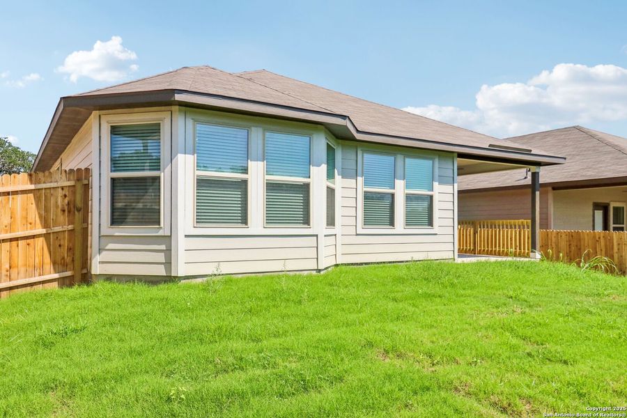 Front exterior of a new home in Scenic Crest - Premier Series, Boerne, TX, highlighting curb appeal (Image 24). Front exterior of a new home in Scenic Crest - Premier Series, Boerne, TX, highlighting curb appeal (Image 24).