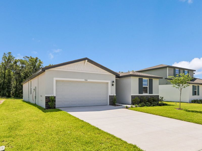Front exterior of a new home in Leyland Preserve - Classic Series, Brooksville, FL, highlighting curb appeal (Image 16). Front exterior of a new home in Leyland Preserve - Classic Series, Brooksville, FL, highlighting curb appeal (Image 16).