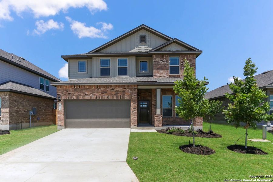 Front exterior of a new home in Buffalo Crossing – New Phase Now Preselling, Cibolo, TX, highlighting curb appeal (Image 14).