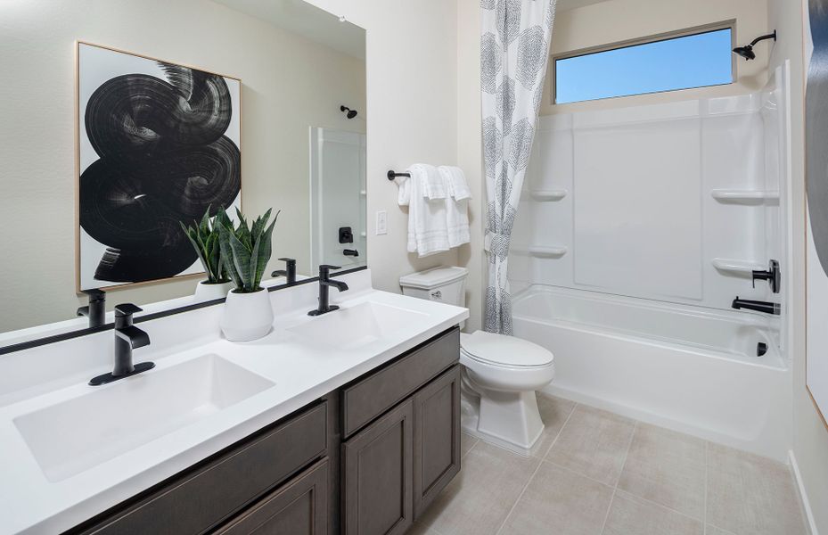 Secondary bathroom with double vanity in Prato new construction at Jorde Farms in Queen Creek, AZ Secondary bathroom with double vanity in Prato new construction at Jorde Farms in Queen Creek, AZ