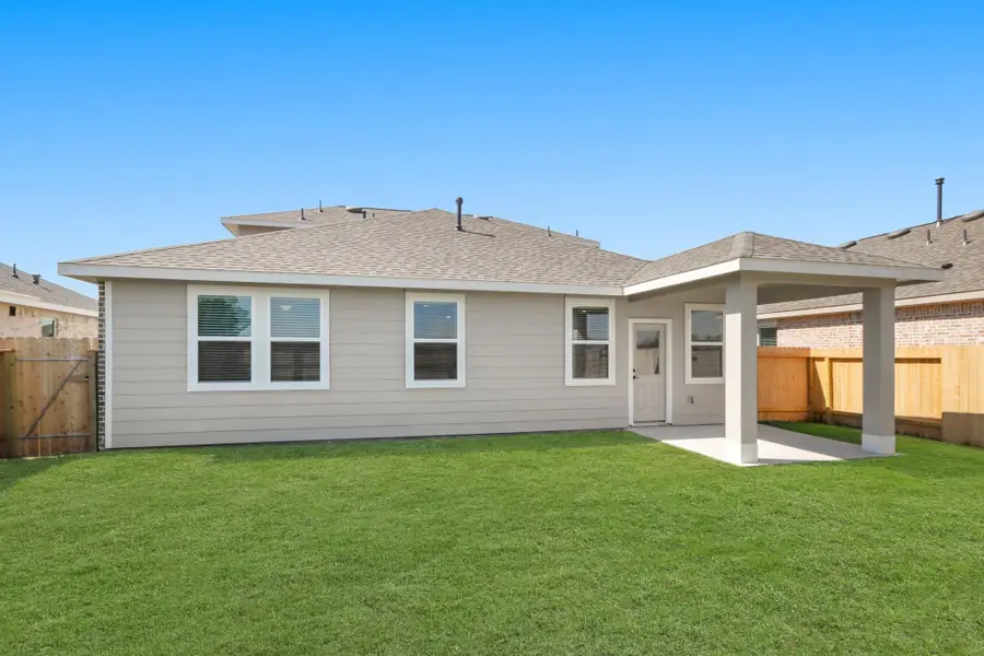Peaceful backyard with covered patio Peaceful backyard with covered patio