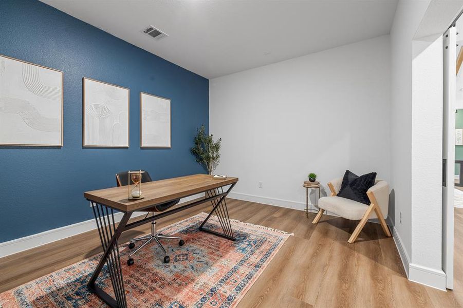 Office space featuring light wood-style floors