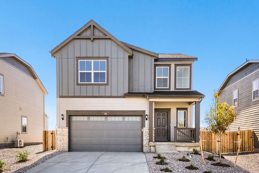 Front exterior of a new home in Muegge Farms, Bennett, CO, highlighting curb appeal (Image 1). Front exterior of a new home in Muegge Farms, Bennett, CO, highlighting curb appeal (Image 1).