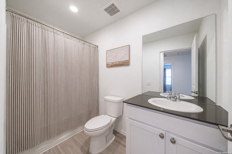 Furnished interior view inside a new home in Mission del Lago, San Antonio (Image 11).