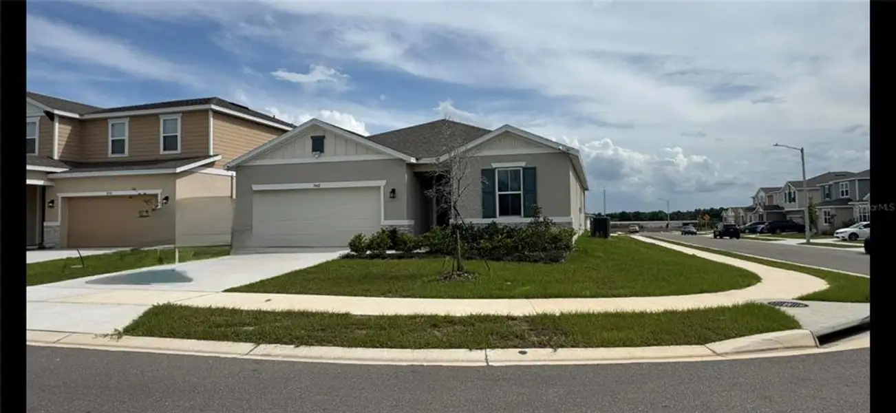 Front exterior of a new home in , Haines City, FL, highlighting curb appeal (Image 1). Front exterior of a new home in , Haines City, FL, highlighting curb appeal (Image 1).