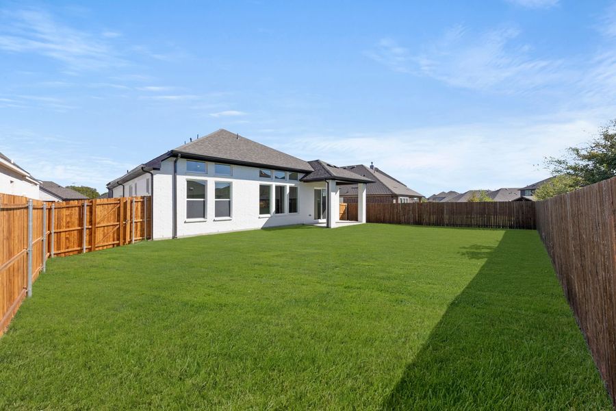 Exterior details and patio area of a home in West Crossing, Anna (Image 17).