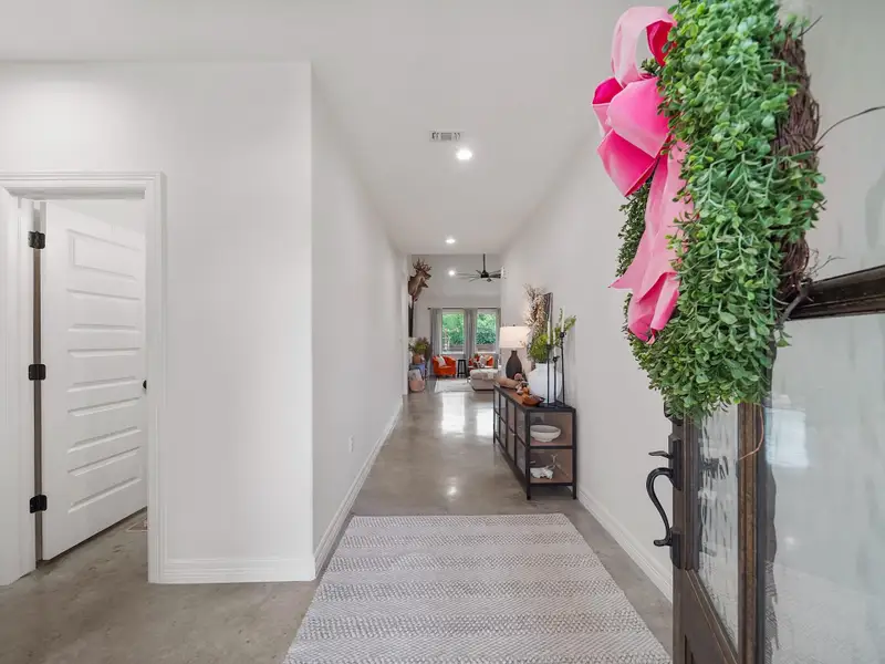 AS YOU WALK IN, YOU CAN'T HELP BUT NOTICE THE NICE STAINED CONCRETE FLOORS!