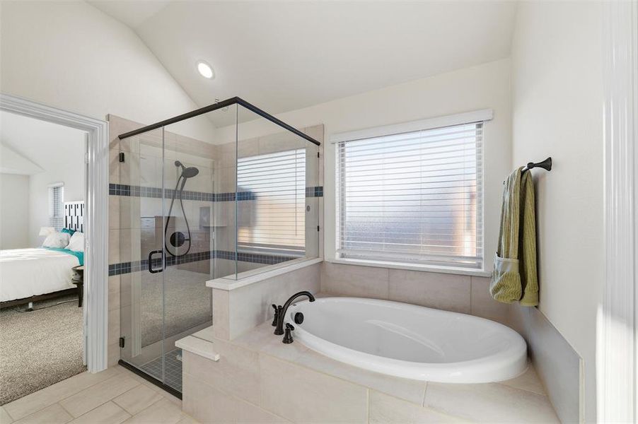 Primary bath has walk in shower and garden tub Primary bath has walk in shower and garden tub