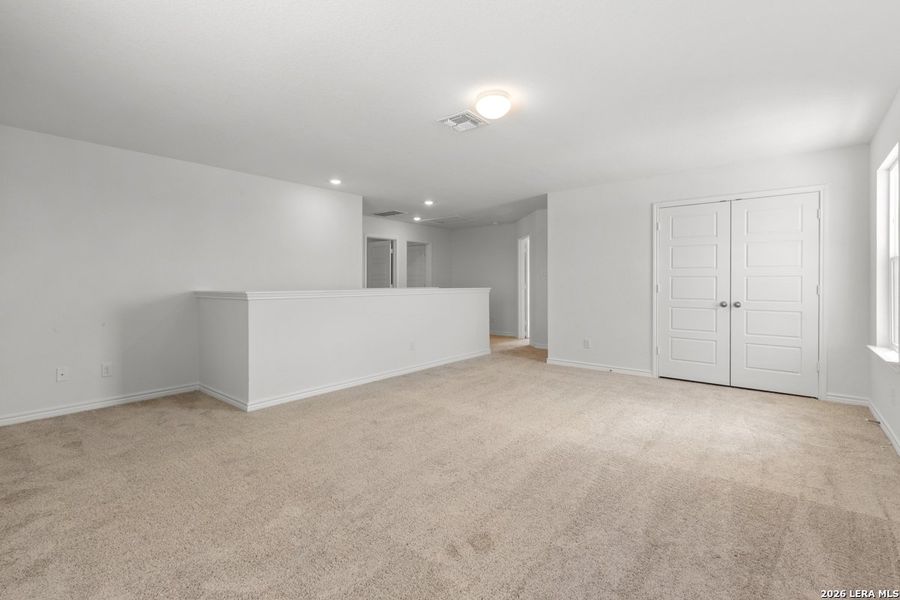 Spacious, unfurnished interior of a new home in Hidden Bluffs at TRP, San Antonio (Image 28).