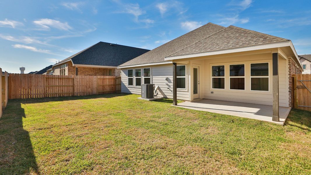Exterior details and patio area of a home in Beamer Villas, Friendswood (Image 3).