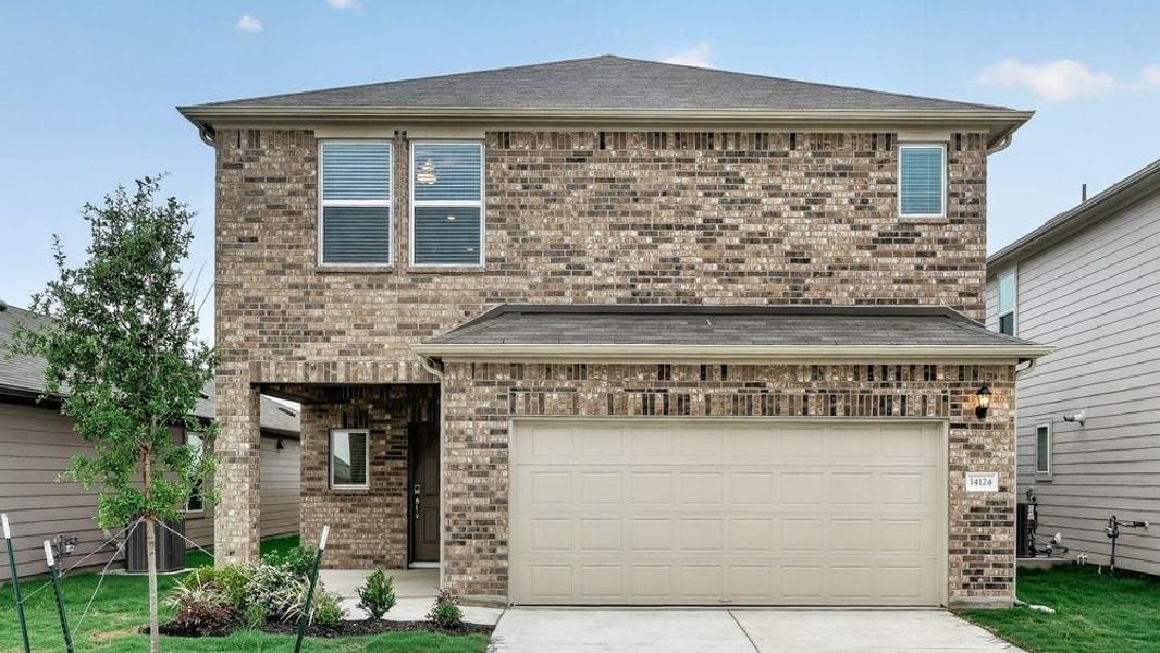 Representative exterior photo of a completed home built from the Osprey by Taylor Morrison in Stonewall Ranch, Liberty Hill, TX (Image 21).
