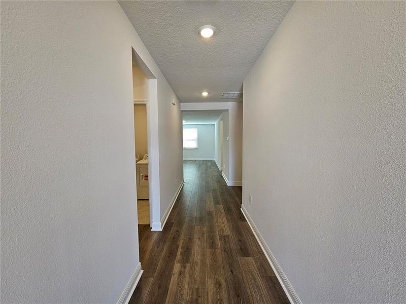 Spacious, unfurnished interior of a new home in The Reserve at Hammock Oaks - Signature Series, Lady Lake (Image 14).