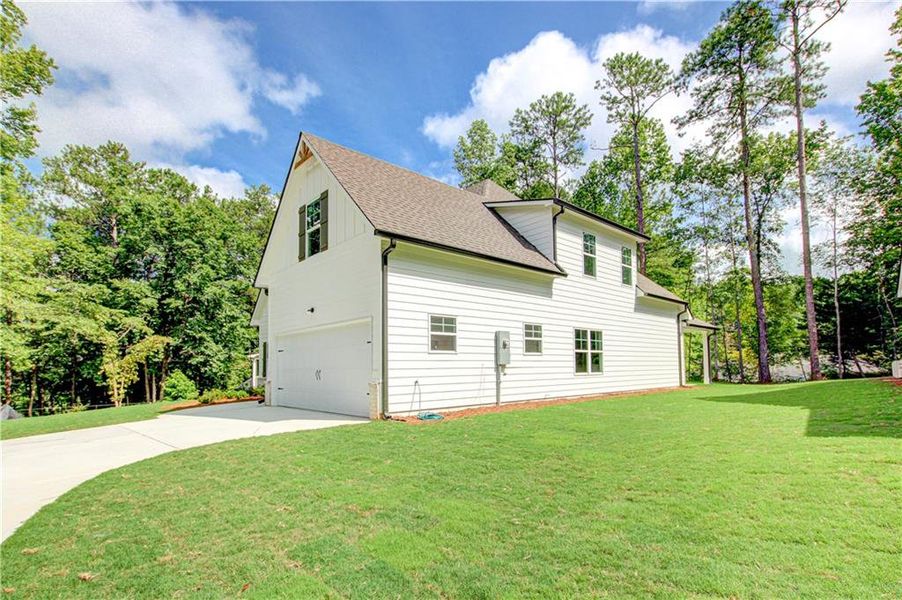 Front exterior of a new home in , Villa Rica, GA, highlighting curb appeal (Image 27).
