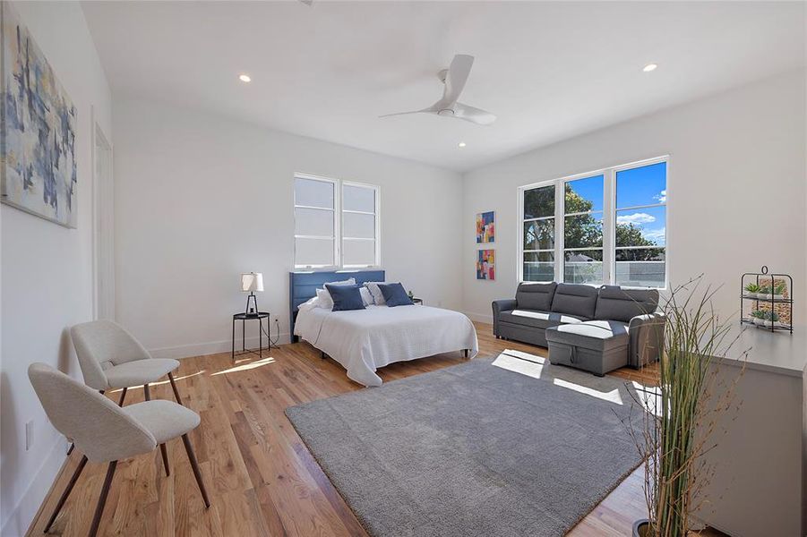 Bedroom featuring ceiling fan and light wood-type flooring