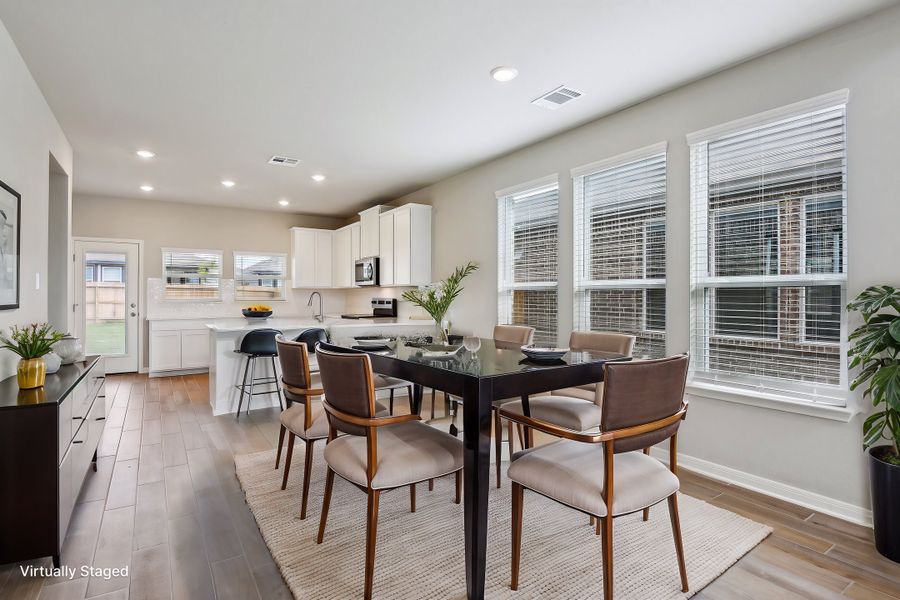 Virtually staged dining room in the Medina floorplan at a Meritage Homes community.