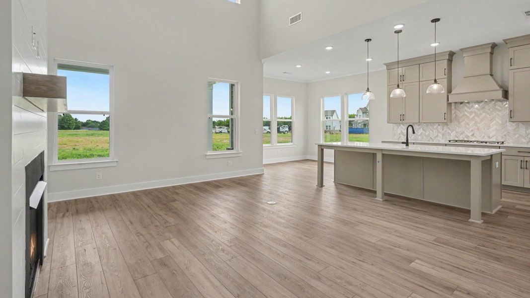 Gathering room with view of kitchen and cafe area