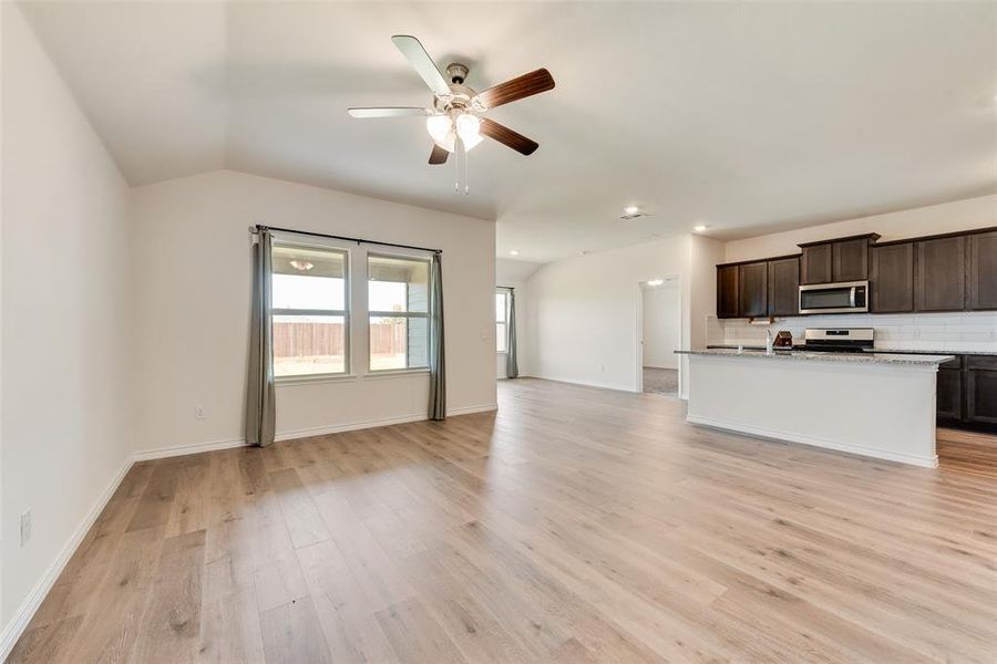 Single story home featuring driveway, brick siding, a yard, and an attached garage Single story home featuring driveway, brick siding, a yard, and an attached garage