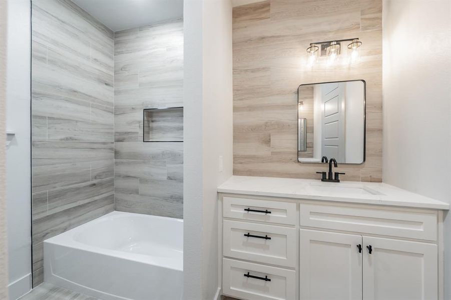 Full bathroom featuring vanity and shower / bath combination