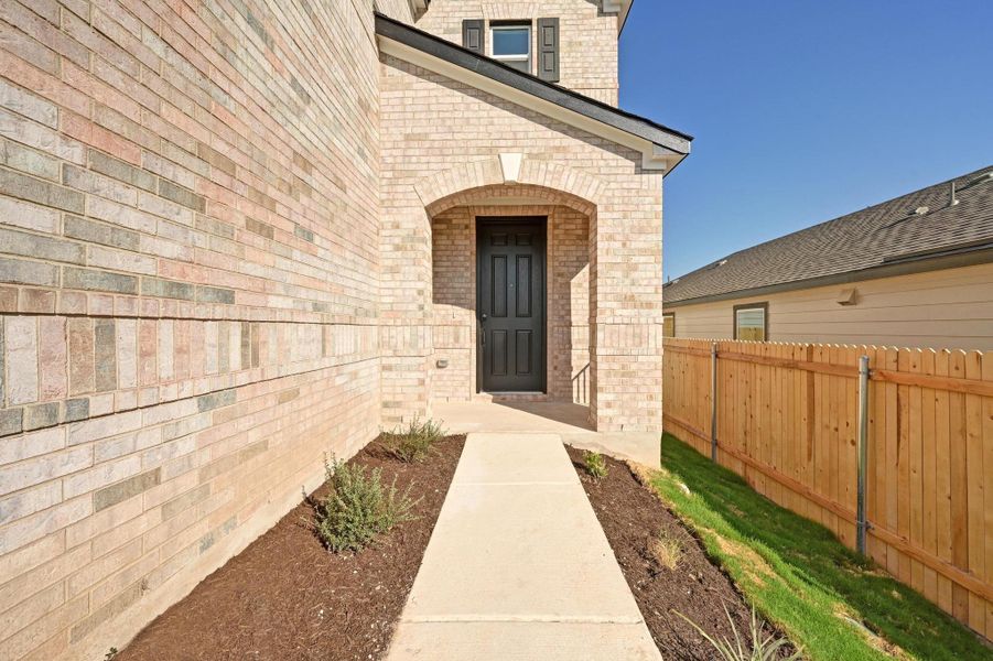 Exterior details and patio area of a home in Creekside at Estancia, Austin (Image 20).