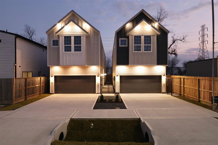 Radiantly illuminated exterior, courtesy of multiple downlights that highlight the home’s architecture and detailing at night, with lights guiding the way to the front entry