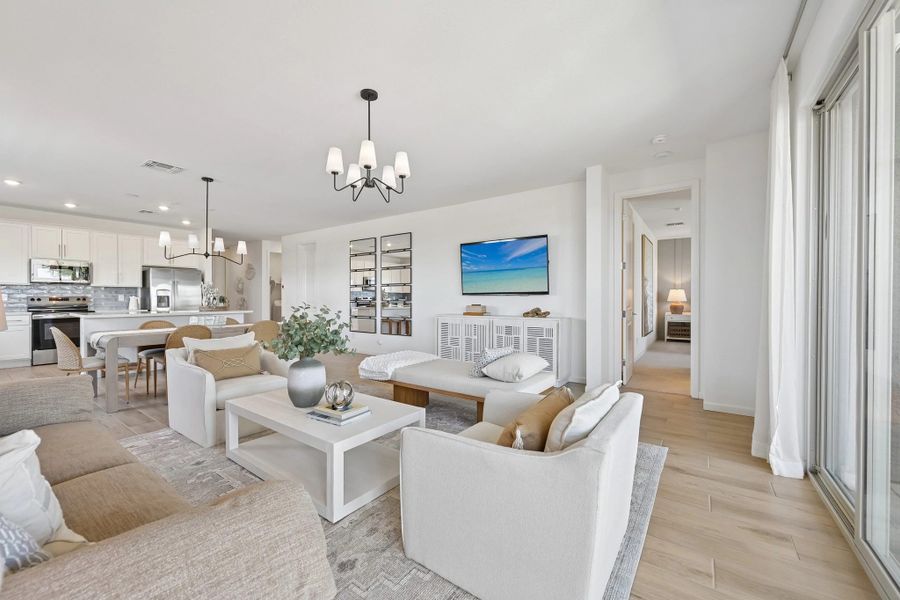 Great room and kitchen. Model home, finishes may vary. Great room and kitchen. Model home, finishes may vary.