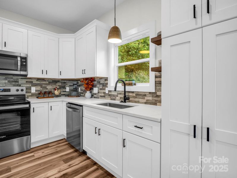 Stainless steel appliances and quartz countertops