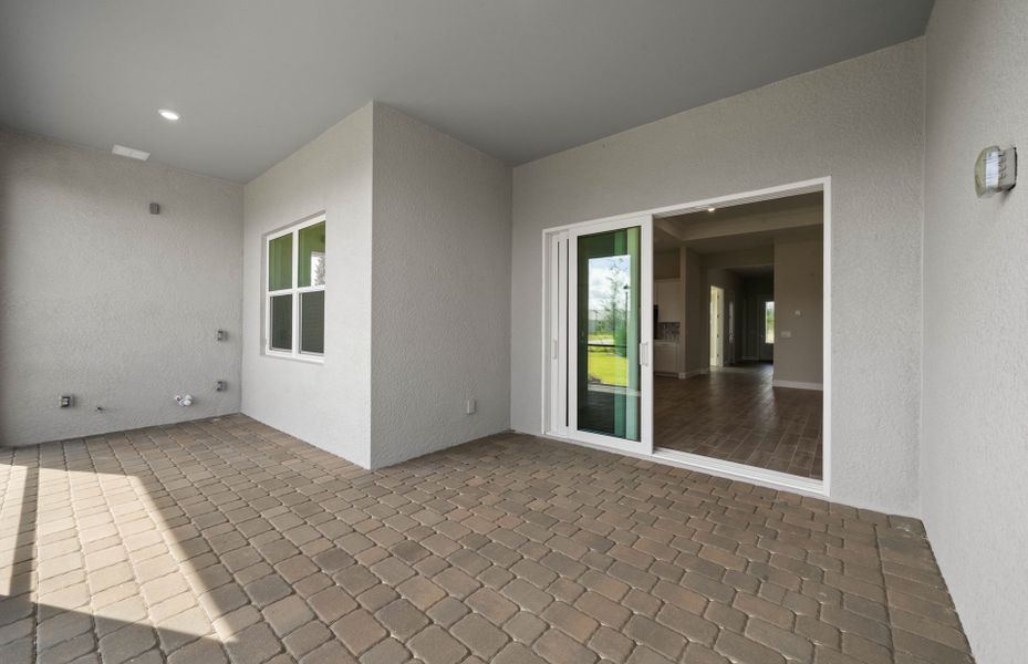 Exterior details and patio area of a home in Del Webb Oak Creek, North Fort Myers (Image 3).