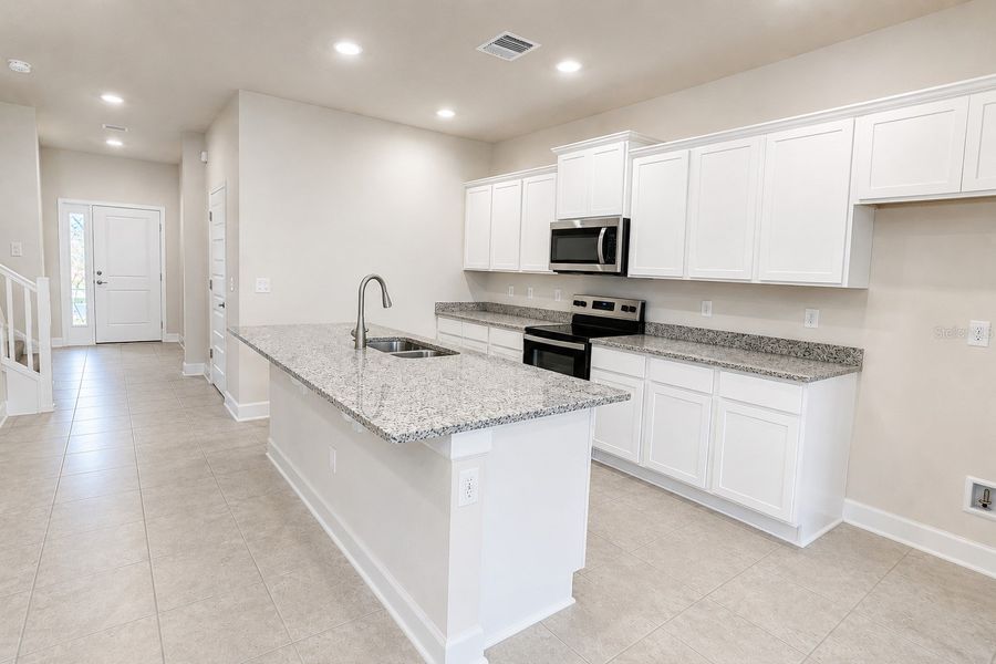 Furnished interior view inside a new home in Harmony Central, St. Cloud (Image 8).