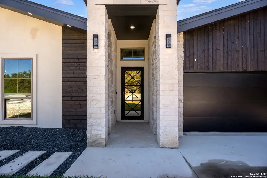 Exterior details and patio area of a home in , Spring Branch (Image 3).