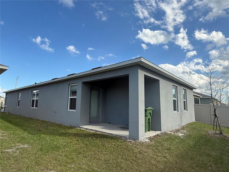 Exterior details and patio area of a home in Villamar by Express Homes, Winter Haven (Image 3).