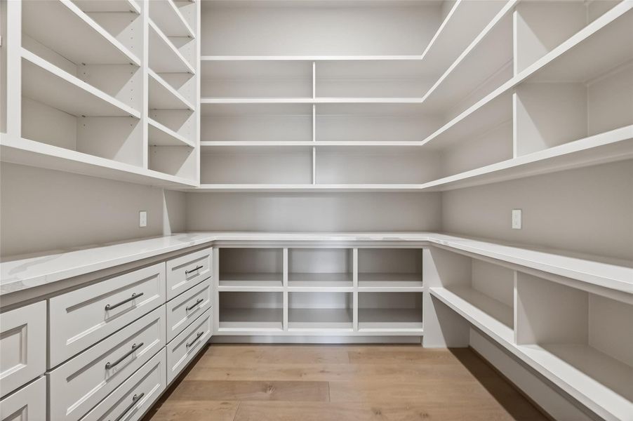 The primary suite is distinguished by its fully customized closets. The primary suite is distinguished by its fully customized closets.