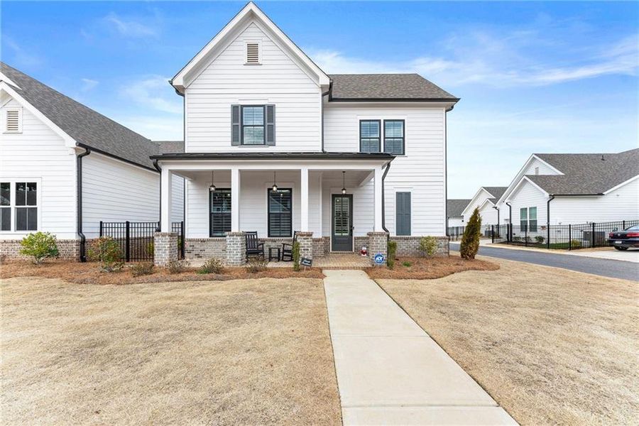 Front exterior of a new home in Promenade at Sawnee Village, Cumming, GA, highlighting curb appeal (Image 26).
