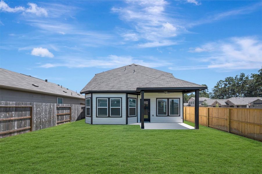 Exterior details and patio area of a home in Pinewood at Grand Texas, New Caney (Image 16). Exterior details and patio area of a home in Pinewood at Grand Texas, New Caney (Image 16).