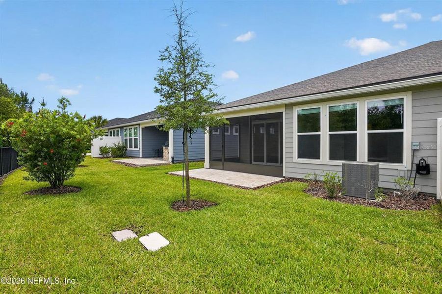 Exterior details and patio area of a home in Del Webb Wildlight, Wildlight (Image 4).