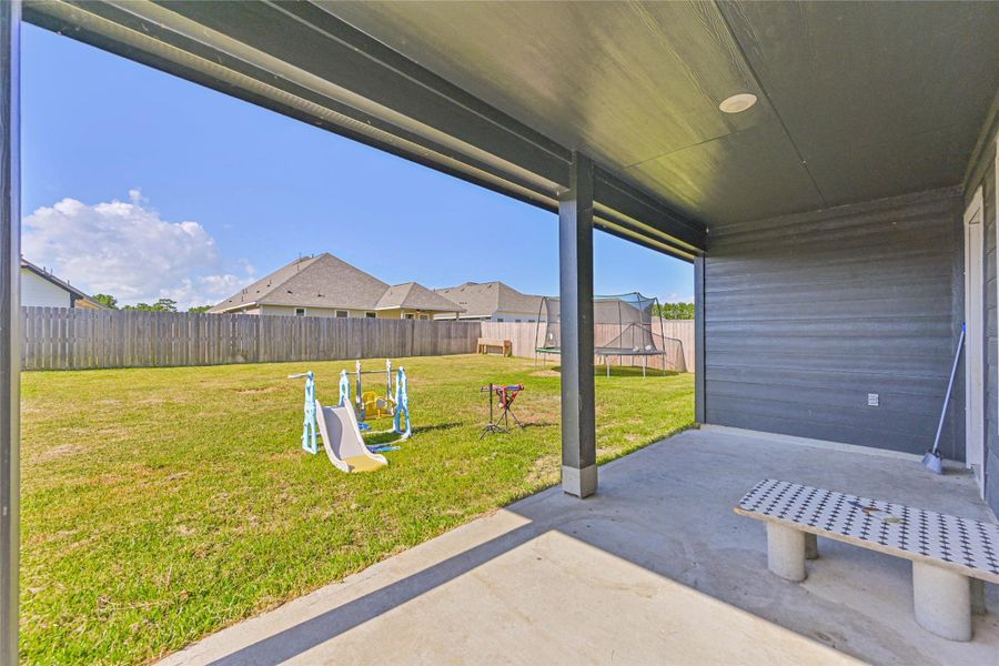 Relax under the covered back patio—great for enjoying Texas sunsets or weekend BBQs.