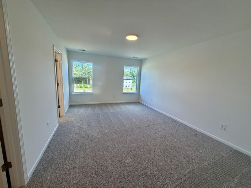 Spacious, unfurnished interior of a new home in Bellevue Townhomes, Greenville (Image 13).