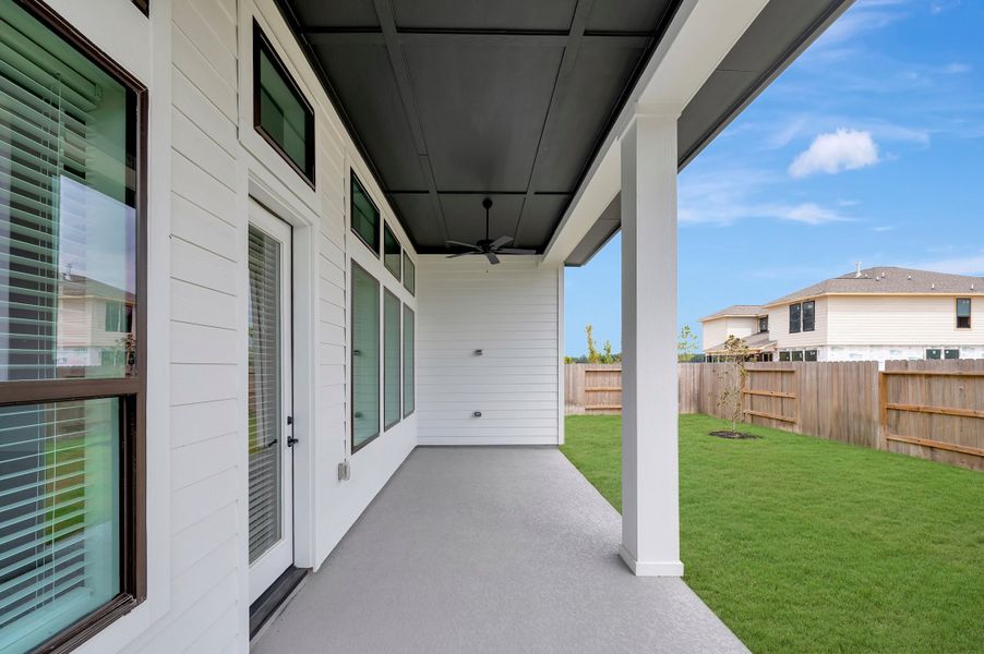 Exterior details and patio area of a home in ARTAVIA - Enclave Collection, Conroe (Image 3).