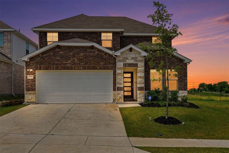 Front exterior of a new home in Briarwood Hills - Highland Series, Forney, TX, highlighting curb appeal (Image 26). Front exterior of a new home in Briarwood Hills - Highland Series, Forney, TX, highlighting curb appeal (Image 26).