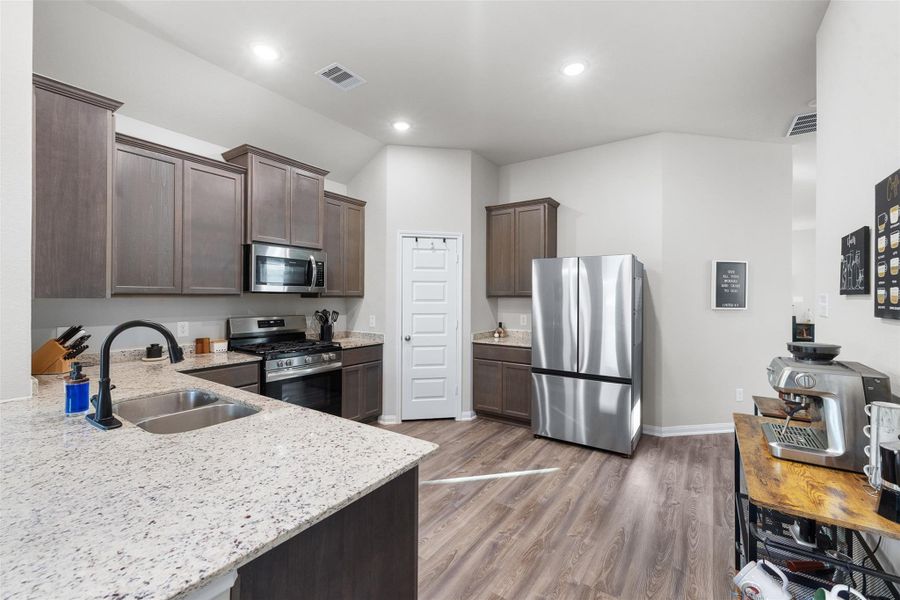 The open layout creates a warm, inviting atmosphere, perfect for cooking and entertaining.