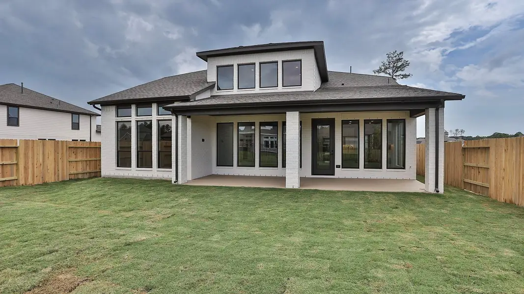 Front exterior of a new home in Artavia 55' - Valencia, Conroe, TX, highlighting curb appeal (Image 1). Front exterior of a new home in Artavia 55' - Valencia, Conroe, TX, highlighting curb appeal (Image 1).