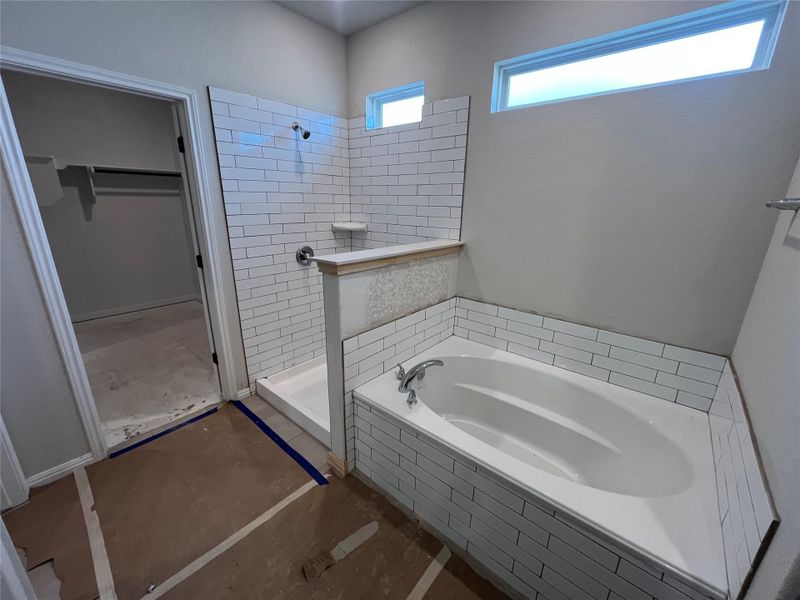 In-progress construction of a new home in The Cottages at Lariat, Liberty Hill, TX (Image 29).