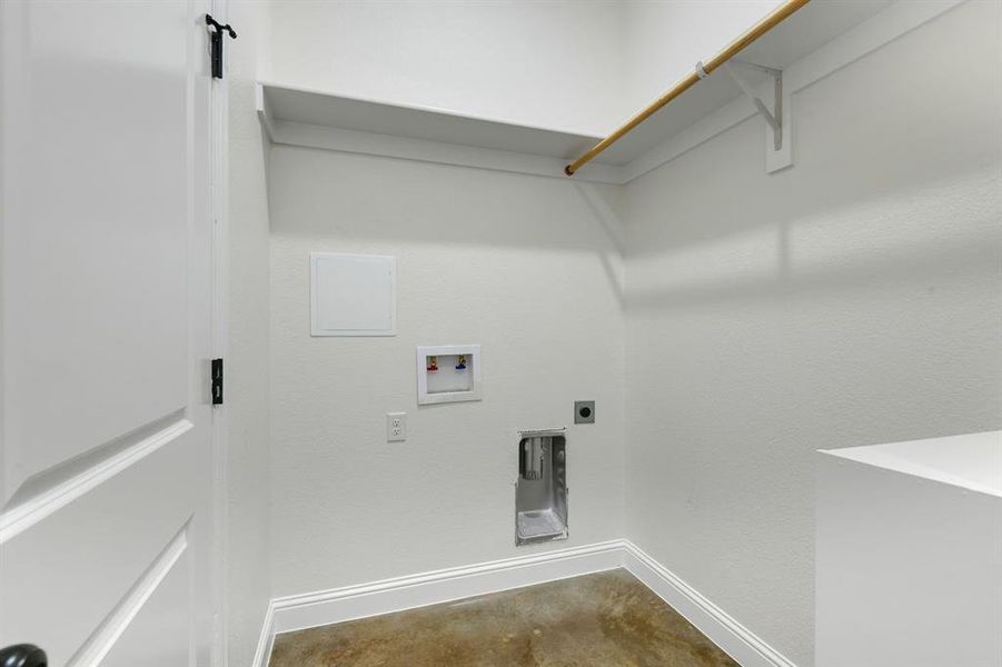 Laundry room with hookup for a washing machine, hookup for an electric dryer, and concrete flooring