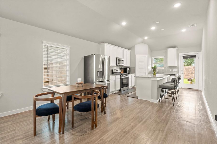 The adjacent dining space comfortably accommodates everyday meals or casual gatherings.