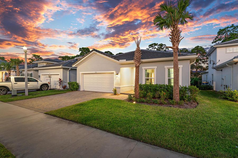Front exterior of a new home in Banyan Bay, Stuart, FL, highlighting curb appeal (Image 1).